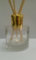 Reed Diffuser Air Freshener Empty Round Glass Diffuser Bottle with Shiny Gold Cap and Travel Plug. Use diffuser bottle to make your own designer room fragrances.