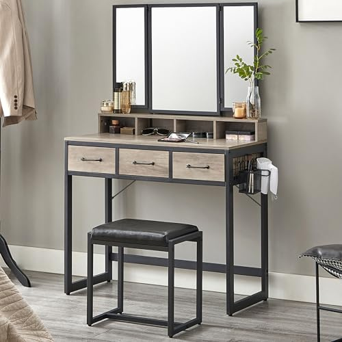 VASAGLE Tavolo da toilette con specchio pieghevole in 3 pezzi, supporto per asciugacapelli, tavolo cosmetico con sgabello imbottito, 3 cassetti, design industriale, Greige e nero RVT004B02