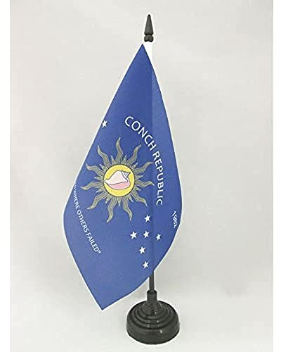 AZ FLAG Drapeau de Table Conch Republic 21x14 cm Socle Plastique | Usage intérieur Drapeau de bureau du key west finition cousue et bords renforcés avec mât en plastique et socle en plastique