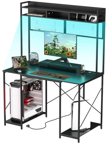 TRIUMPHKEY Escritorio Gaming con LED, 120x60cm Escritorio de Ordenador con Soporte y Estante de Almacenamiento, Mesa de Juego Ergonómico con Enchufe y 2 Tomas USB para Salas de Juego y Oficina Negro