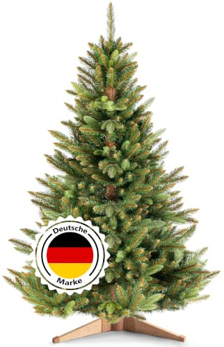 RESTILO Premium Künstlicher Weihnachtsbaum 220 cm - 10 Jahre Garantie Maya | dichte Zweige Ø 125 cm | Nordmanntanne mit braunem Stamm & Holzständer | Tannenbaum künstlich I Made in EU