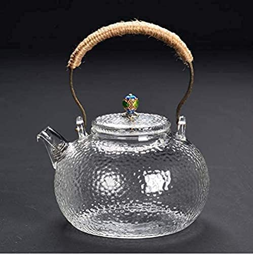 Einfaches und kreatives Gusseisen-Set aus Glas. Einfaches und kreatives Wasserkocherglas mit Edelstahl-Sieb. Oolong-Teekanne in schwarzem beheiztem Behälter. Guter, klarer, einfacher und kreativer Wa