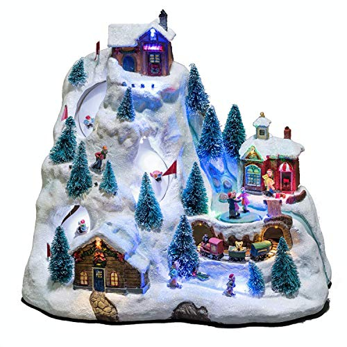 Konstsmide LED 3403-000 - Pista de esquí con animación, 8 villancicos navideños clásicos, fuente de alimentación seleccionable, 15 diodos de colores, transformador interior de 4,5 V, funciona con
