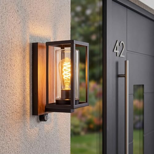 HOFSTEIN Außenwandleuchte Portalis, Außenwandlampe m. Bewegungsmelder aus Metall/Glas in Schwarz/Holzoptik/Klar, Wandleuchte im Industrial-Stil mit Lichteffekt, E27, IP44, Eingangsbereich, Haustür