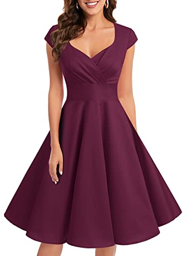 1950-tals cocktailklänning i vintage-/retrostil från Bbonlinedress. Rockabilly, V-ringad, veckad kjol, aftonklänning, festklänning.