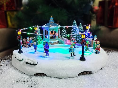 MOMENTS IN TIME Animated Skating Pond 7.28”H LED Christmas Village Display with Moving Skaters, Lights & Music, Adapter or Battery Operated, Handcrafted Polyresin Decor