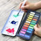 Stationery Island Aquarelle Peinture Aquarelle Set de peinture à l'aquarelle, 24 Couleurs pan + 1 Pinceau Aquatique + 1 Pinceau + Palette de mélange dans Une boîte en Fer-Blanc