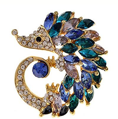 Broche bijou style hérisson doré avec strass cristal.