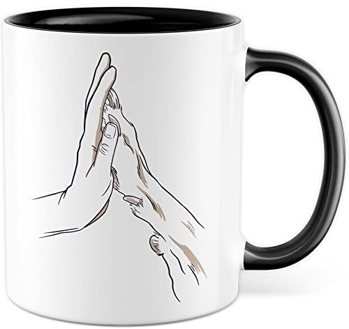 Tasse Hund & Mensch Geschenk Geschenkidee Herrchen Frauchen Hundemama Hundepapa Vierbeiner Comic Kaffeetasse mit Hundemotiv Kaffee-Becher Hund mit Mensch Teetasse Hand und Pfote (Weiß/Schwarz)