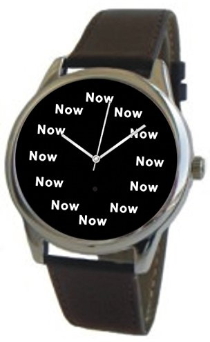 Now Is The Time That Is Shown Each Hour on The Black Dial of The Extra Large Polished Chrome Watch with a Black Leather Strap