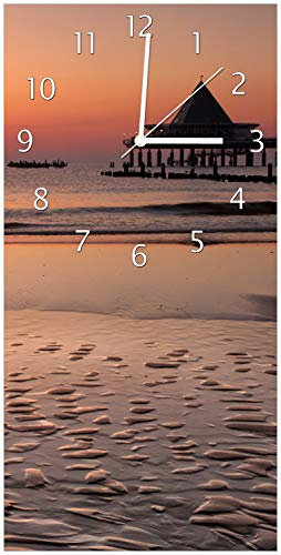 Wallario Design-Wanduhr Strand am Abend - Seebrücke am Ostseebad Heringsdorf aus Glas, Motiv-Uhr Größe 30 x 60 cm, weiße Zeiger
