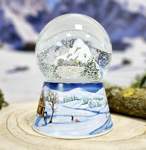 Schneekugel Weihnachten Spieluhr | Winterlandschaft Berge | Sockel Winterlandschaft Mittelblau | Musik Winter Wonderland | Schüttelkugel Weihnachtsdekoration | B: 10 cm H: 14 cm | 20290