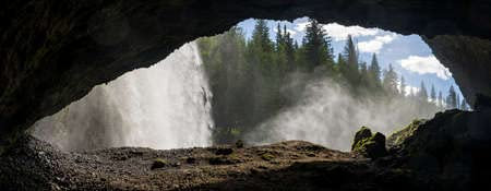 adrium Acryl-Bild 80 x 30 cm: Cave hinter dem Wasserfall mit Blick auf einen Wald(162767382)