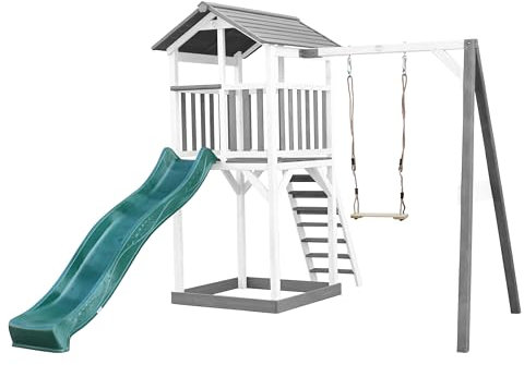 AXI Beach Tower parco giochi in legno in grigio e bianco | Torre di gioco per bambini con sabbiera, altalena e scivolo verde | Casa per bambini su palafitte per il giardino
