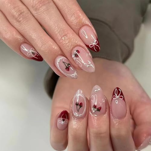 Almond False Nails, Medium Length, Nude Pink And Deep Red Cherry Design | Glossy French-Style Tips, Bows, White Linework, Green Stems And Silver-Toned Reflective Details, For Daily Wear And Parties