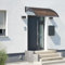 [en.casa] Marquesina para Puertas Tejadillo de Protección Toldo Exterior Terraza Techo para Balcón Diseño Arqueado de Policarbonato Aluminio 100 x 60 cm - Negro y Marrón