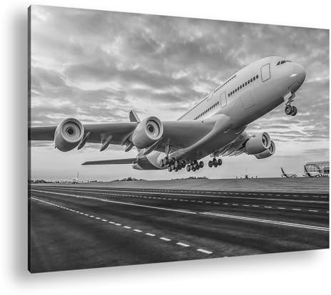 Leinwandbild Ein Flugzeug verschwindet im farbenprächtigen Sonnenuntergang Format: 120x80 cm Effekt: Schwarz&Weiß XXL Kunstdruck Bild auf Keilrahmen/Wandbild/Wohnzimmer Deko
