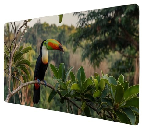 Tukan im Dschungel Schreibtischunterlage 89x40cm XXL Mauspad - Exotisches Design für Ihr Büro Foto des Tukan mit orangefarbenem Schnabel auf grünem Ast Beruhigende Blätter