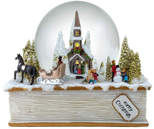 The San Francisco Music Box Schneekugel mit Winterurlaubsszene auf Buch