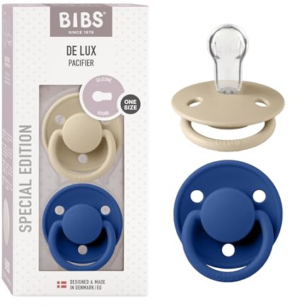 BIBS De Lux Schnuller, 0+ Monate, 2er-Pack, Vanilla/Cornflower | Runder Sauger | Silikon | Einheitsgröße | BPA-frei | Hergestellt in Dänemark | Hohe Akzeptanz | Luftlöcher | Komfortschild