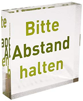 Transparenter Acrylblock als Infoständer/Hinweisaufsteller mit grünem Aufdruck „Bitte Abstand halten“ aus PLEXIGLAS®