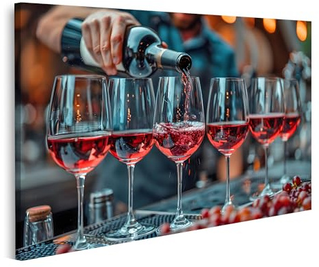 islandburner Bild auf Leinwand Eine Person füllt eine Reihe Weingläser mit edlem Rotwein auf dem Wandbild Weinkeller Weinhandel Wandbilder Bilder