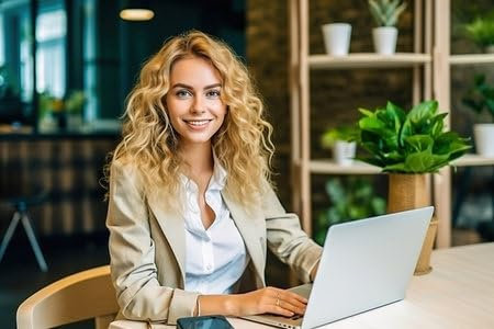 Holz-Bild 120 x 80 cm: Eine blonde Frau im formellen Anzug arbeitet an einem Laptop. Hochwertiges Foto (216318372)