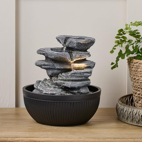 Lights4fun Zimmerbrunnen „Ingleton“ | Wasserspiel mit warmweißen LEDs | mit Stromanschluss | Deko für Innenbereiche | Zierbrunnen in Grauer Steinoptik mit schwarzer Schale | Maße 23 cm x 20,5 cm