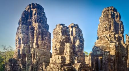 Holz-Bild 60 x 30 cm: Buddha-Gesichter im Bayon-Tempel in Angkor Thom zur Morgenzeit. Siem Reap. Kambodscha. Panorama (115869213)