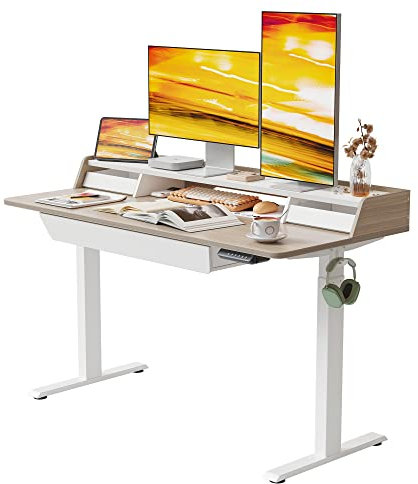 FEZIBO Bureau debout électrique - 140 x 65 cm - Table réglable en hauteur - Meuble de bureau ergonomique avec 3 tiroirs - Cadre blanc - Plateau en noyer clair