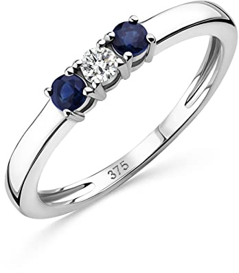 OROVI Anello Trilogy con Diamante Naturale centrale e due Zaffiri Blu Naturali laterali. Anello di fidanzamento in Oro Bianco lucido ipoallergenico 9Kt/375.
