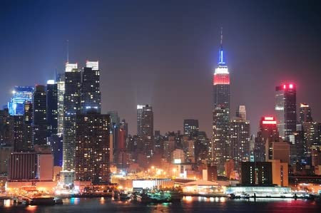 adrium Holz-Bild 110 x 70 cm: New York City Manhattan Midtown Skyline nachts mit Wolkenkratzern über Hudson River mit Reflexionen beleuchtet.(11990316)
