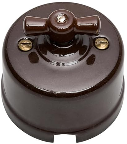 Conmutador de superficie, porcelana marrón, compatible con sistemas eléctricos, ideal para controlar luces y dispositivos en el hogar.