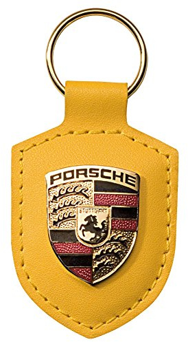 Porsche Schlüsselanhänger aus gelbem Leder mit silbernem Metallwappen, offizielles Lizenzprodukt