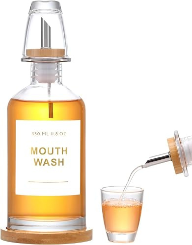 BIKALAN Dispensador de enjuague bucal de vidrio para baño con boquilla de acero inoxidable y bambú, vaso de enjuague bucal reutilizable, bandeja de bambú y elegante pegatina dorada, transparente