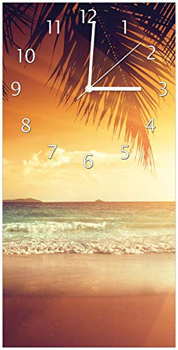 Wallario Design-Wanduhr Sonnenuntergang am Strand in der Karibik aus Glas, Motiv-Uhr Größe 30 x 60 cm, weiße Zeiger
