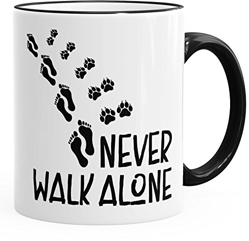 MoonWorks Kaffee-Tasse Never walk alone Hund Pfoten Hundepfoten Pfotenabdrücke Hundebesitzer Schwarz unisize