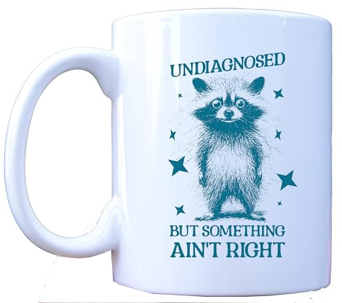 MILLHOUSE PRINTS Funny Raccoon Mug - Undiagnosed But Something Ain't Right - Mental Health Humor Gift - Anxiety Depression Support - 11oz Ceramic Coffee Cup