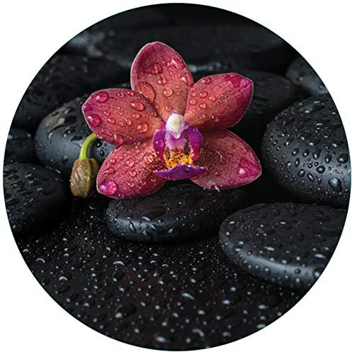 Wallario Glasbild rund Orchideen-Blüte auf schwarzen Steinen, benetzt mit Wasser-Tropfen - Rund, 50 cm Durchmesser Wandbild Glas in Premium-Qualität: Brillante Farben, freischwebende Optik