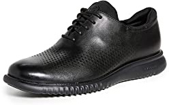 Cole Haan Men's 2.Zerogrand Laser Wingtip Oxford, Black Leather/Black, 11