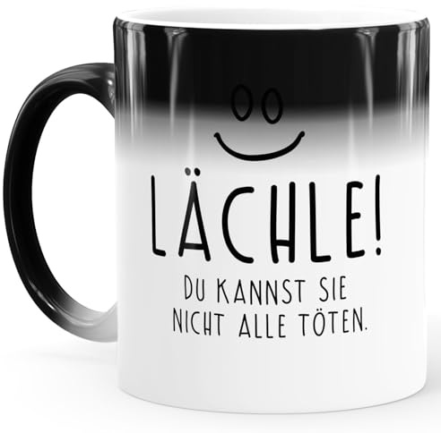 MoonWorks® Zaubertasse Farbwechsel Tasse lustiger Spruch lächle du kannst sie nicht alle töten Symbol Bürotasse Weiss Magic-Tasse