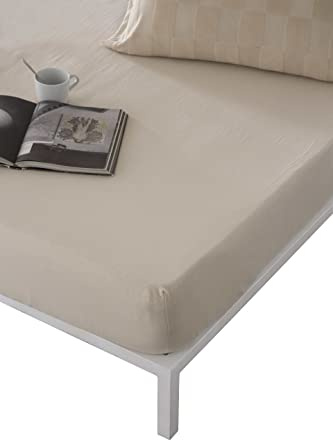 Naturals - Sabana Bajera Cama 150 - Jersey 100% Algodon Totalmente Ajustable para colchones de hasta 33 centimetros de Altura - Bajera 150x190/200 - Elba Beige