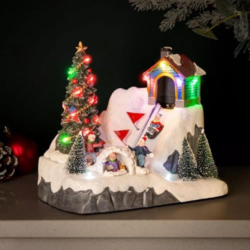 Marco Paul - Decorazione natalizia con villaggio di Natale, con luci a LED multicolore e alimentate a batteria, decorazione musicale da tavolo