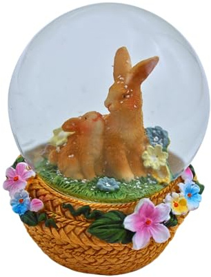 Dekohelden24 Schüttelkugel, Oster - Schneekugel, Schneekugel mit Osterhase, Osterhasen im Korb, Osterkugel zum Schütteln, Hasenpaar mit bunten Blumen und Korb als Sockel, L/B/H 7 x 7 x 9 cm.