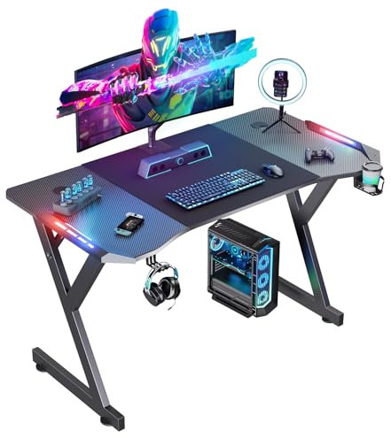 Mesa Gaming 120cm x 60cm, Ergonómico Mesa Gamer con LED, Escritorio con Tablero de Fibra de Carbono, Desk para Computadora con Portavasos y Gancho para Auriculares, Negro