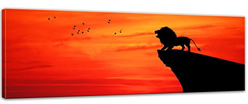 Bilderdepot24 Keilrahmenbild Löwe im Sonnenuntergang - 120x40 cm Bilder als Leinwanddruck Fotoleinwand Tierbild Großkatze - Savanne - Löwe auf einem Felsen