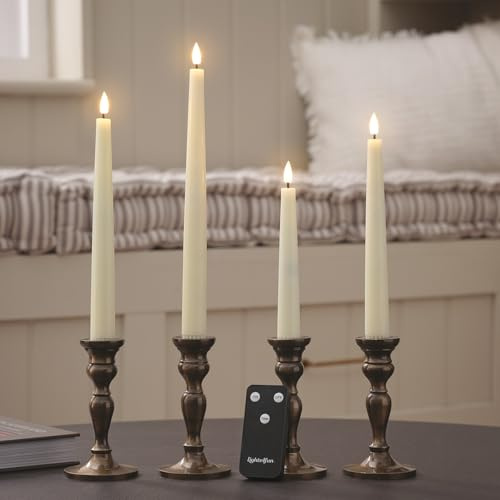 Lights4fun 4er-Set TruGlow® Spitzkerzen aus Echtwachs | Warmweiße flackernde LEDs | mit Fernbedienung & Timer | Batteriebetrieben | Deko Frühjahr Wohnbereich | Verschieden Größen | Elfenbeinfarben