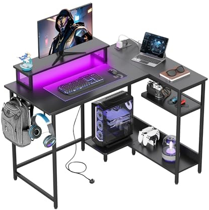 DEVAISE L Shaped Gaming Desk with Power Outlets & RGB LED Lights, 111CM Gaming Desk with Monitor Stand & Hook, Corner Desks with Storage Shelf for Home Office & Small Spaces, Black