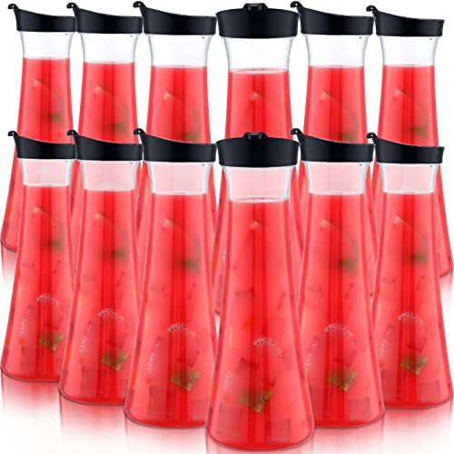 Xinnun 12 Pcs Clear Water Carafe with Flip Top Lid 34 oz Plastic Juice Pitchers Beverage Containers for Mimosa Bar Milk Iced Cold Drinks Lemonade Water Carafe for Home Restaurant School