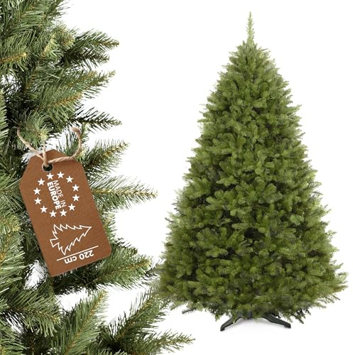 KADAX Weihnachtsbaum, künstlicher Christbaum aus PVC-Kunststoff, Fichte inkl. Kunststoffständer 220cm, Naturgetreuer Baum Ø ca. 130, Baum mit 92 Zweigen und 18 Baumkronen (Waldlichtung 220cm)